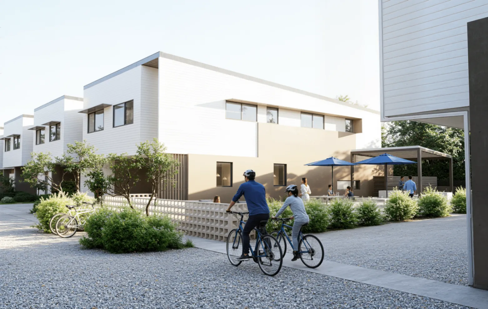 Residents cycling past the SAVI communal courtyard